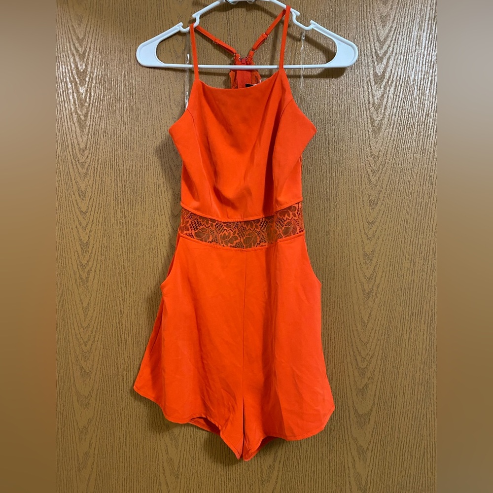 Orange romper with lace detail